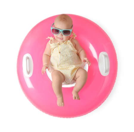 Cute little baby in sunglasses with inflatable ring on white background, top viewの写真素材