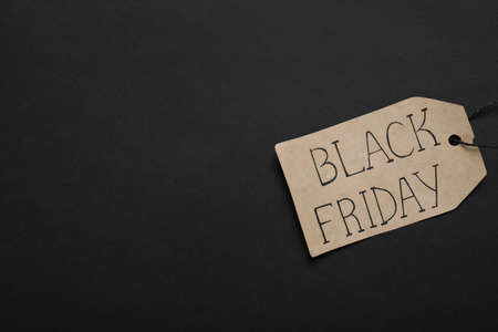 Black Friday tag on color background, top view. Space for textの写真素材