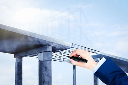 Man drawing picture of bridge, closeup. Business cooperation conceptの写真素材