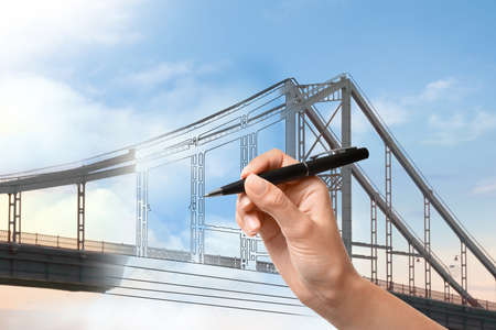 Woman drawing picture of bridge, closeup. Business cooperation conceptの写真素材