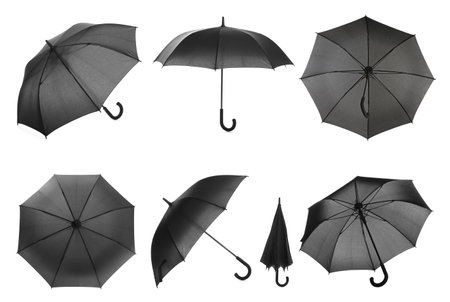 Set with stylish black umbrellas on white backgroundの写真素材