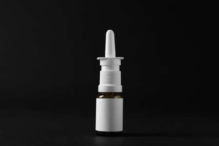 Bottle of nasal spray on black backgroundの写真素材