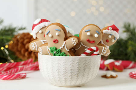 Delicious homemade Christmas cookies in bowl on white wooden tableの写真素材