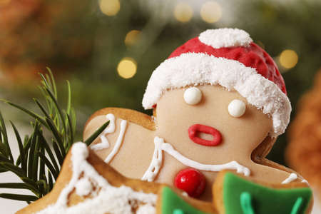 Delicious homemade Christmas cookies against blurred festive lights, closeup