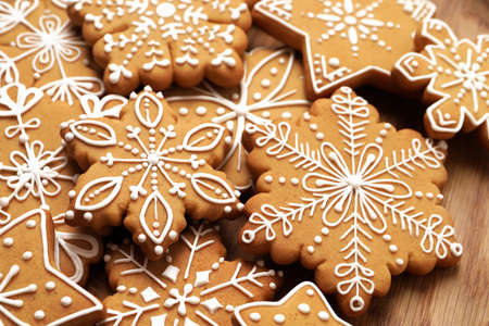 Tasty Christmas cookies on wooden plate, closeupの写真素材