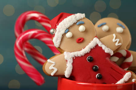 Delicious homemade Christmas cookies in cup against blurred festive lights, closeupの写真素材