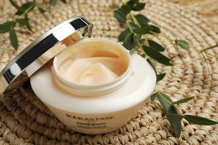 MYKOLAIV, UKRAINE - SEPTEMBER 07, 2021: Kerastase hair mask on wicker mat, closeupのeditorial素材