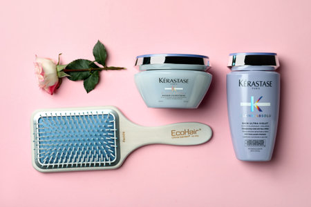 MYKOLAIV, UKRAINE - SEPTEMBER 07, 2021: Flat lay composition with Kerastase hair care cosmetic products on pink backgroundのeditorial素材