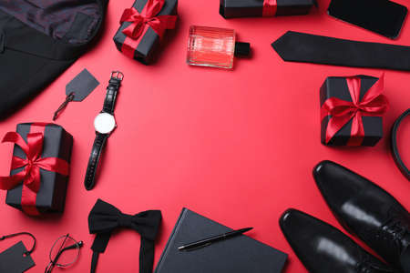 Frame of gift boxes and men's accessories on red background, flat lay with space for text. Black Friday saleの写真素材