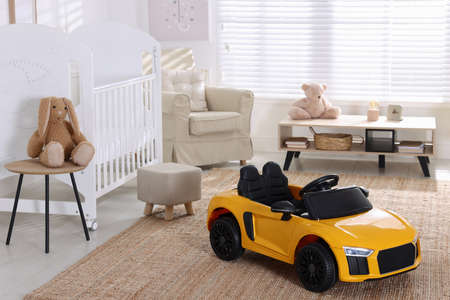 Yellow car in room at home. Child's toyの写真素材