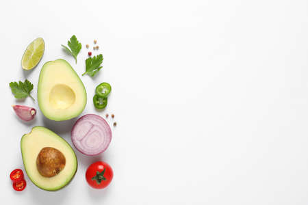Fresh ingredients for guacamole on white background, flat layの写真素材