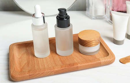 Different cosmetic products on white wooden tableの写真素材