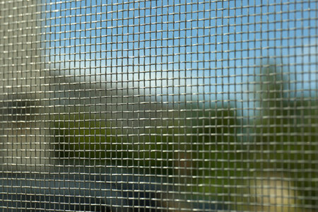 Closeup of mosquito window screen, view from insideの写真素材