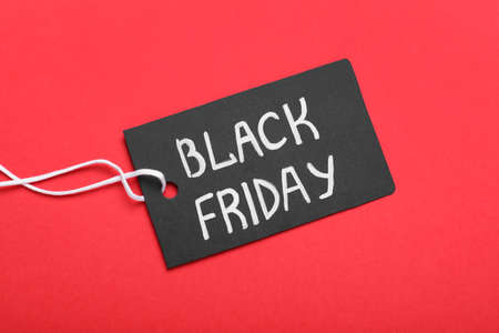 Tag with words Black Friday on red background, top viewの写真素材