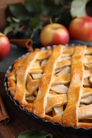 Delicious traditional apple pie on wooden table, closeupの写真素材