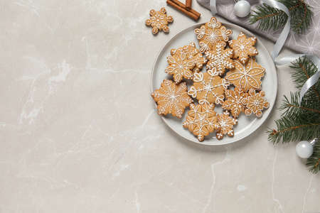 Tasty Christmas cookies and festive decor on light gray table, flat lay. Space for textの写真素材