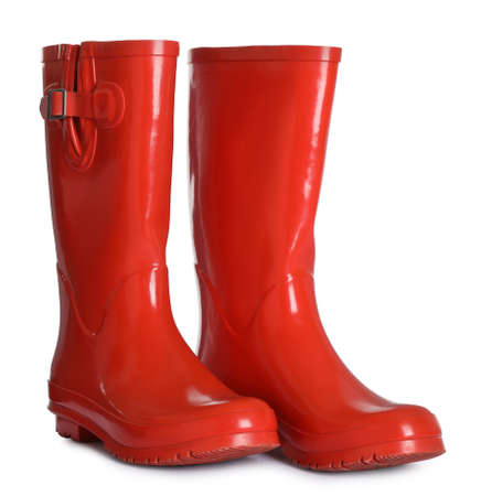 Modern red rubber boots isolated on whiteの写真素材