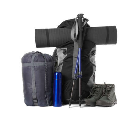 Pair of trekking poles and camping equipment for tourism on white backgroundの写真素材