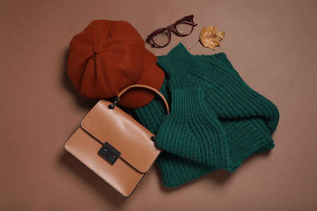 Flat lay composition with stylish hat on brown backgroundの写真素材