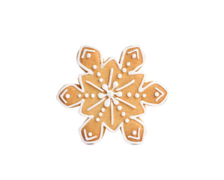 Tasty snowflake shaped Christmas cookie isolated on whiteの写真素材