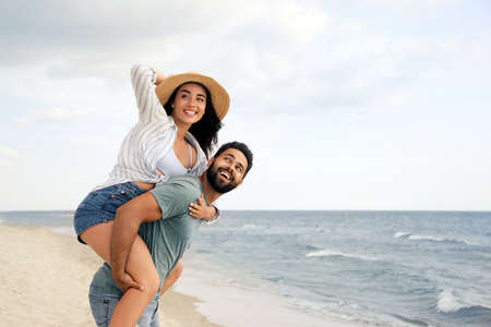 Lovely couple spending time together on beachの写真素材