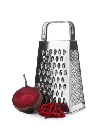 Stainless steel grater and fresh beetroot on white backgroundの写真素材