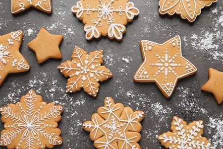 Tasty Christmas cookies on gray table, flat lay