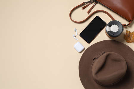 Flat lay composition with stylish hat on beige background, space for textの写真素材