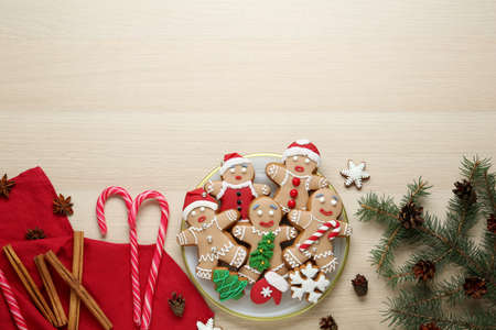 Flat lay composition with delicious Christmas cookies on beige wooden table, space for textの写真素材