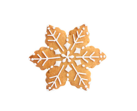 Tasty snowflake shaped Christmas cookie isolated on whiteの写真素材
