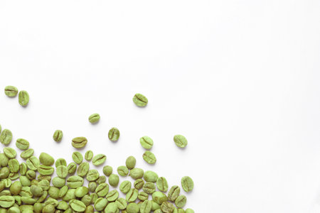Many green coffee beans on white background, top viewの写真素材