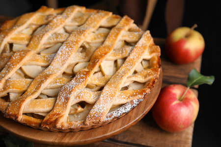 Delicious traditional apple pie on wooden stand, closeupの写真素材