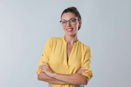 Beautiful woman in eyeglasses on white backgroundの写真素材