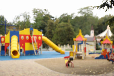 Blurred view of children's playground on autumn dayの写真素材