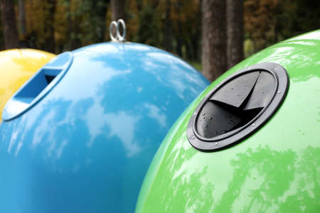 Waste sorting bins in park on autumn day, closeupの写真素材