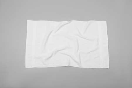 Crumpled white beach towel on light gray background, top viewの写真素材