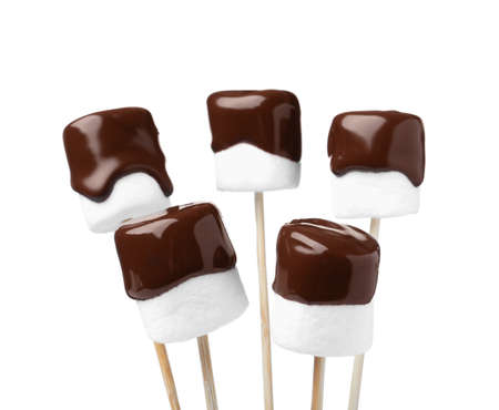 Tasty marshmallows dipped into chocolate on white backgroundの写真素材