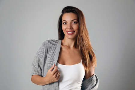 Portrait of beautiful woman on light gray backgroundの写真素材