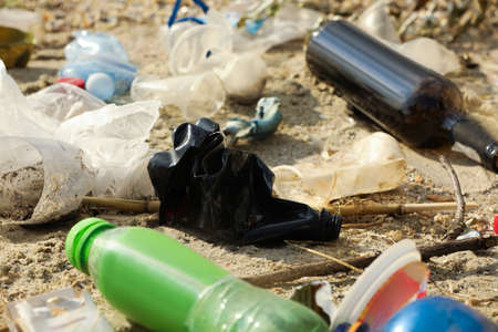 Garbage scattered on beach. Environment pollution problem