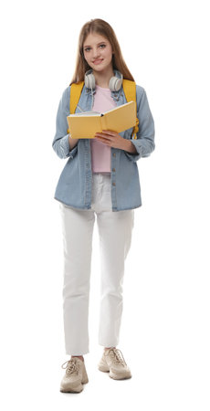 Teenage student with backpack, book and headphones on white backgroundの写真素材