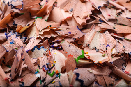 Pile of colorful pencil shavings as background, closeup