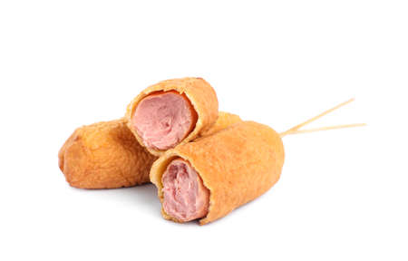 Delicious deep fried corn dogs on white backgroundの写真素材