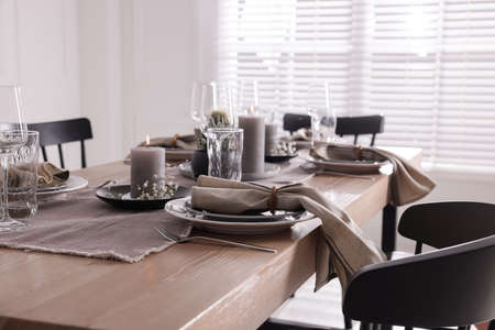 Festive table setting with beautiful tableware and decor indoorsの写真素材