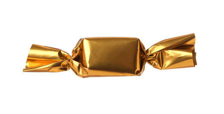 Delicious candy in golden wrapper isolated on whiteの写真素材