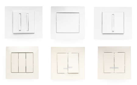 Set with different light switches on white background