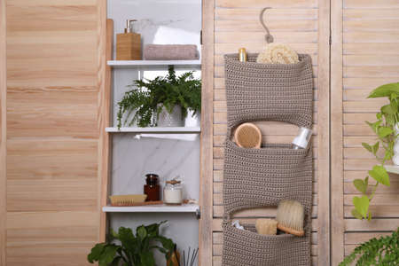 Shelving unit and organizer with essentials in bathroom. Stylish accessoryの写真素材