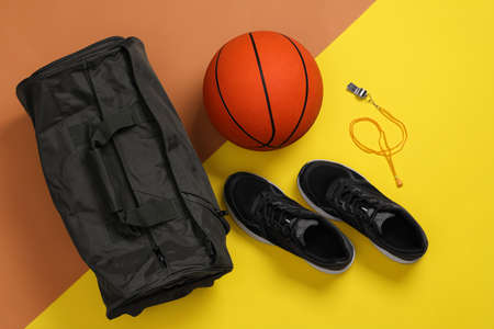 Gym bag and sports equipment on color background, flat layの写真素材