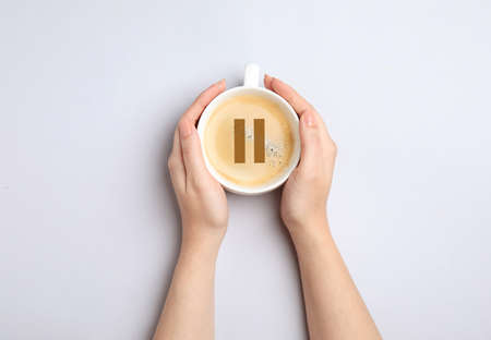 Coffee Break. Woman with cup of americano on white background, top viewの写真素材