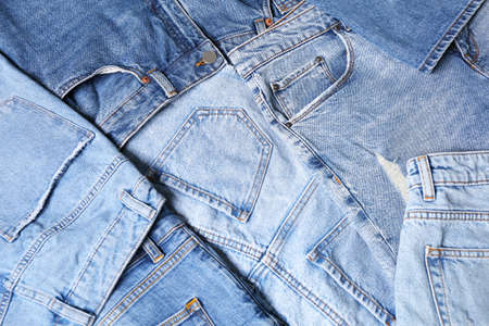 Variety of jeans with different pockets as background, closeupの写真素材