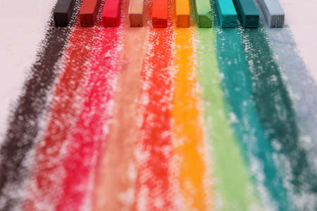 Colorful pastel chalks on white background, closeup. Drawing materialsの写真素材